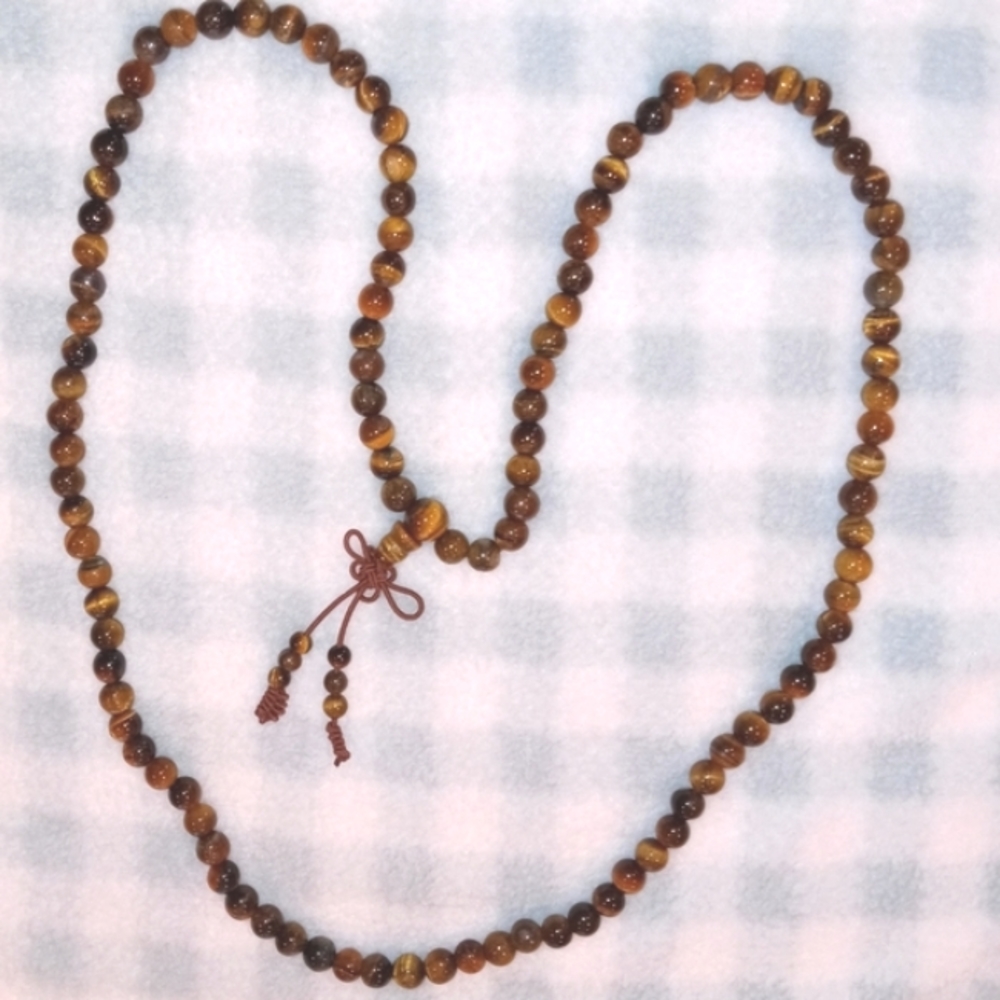 Tigers eye bead necklace   25 inches long.